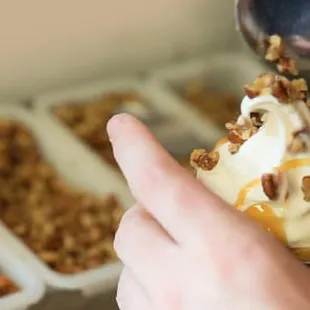 a hand holding a spoon