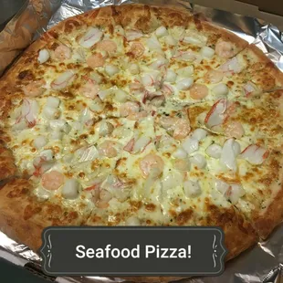 a seafood pizza on aluminum foil