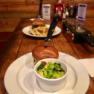 a burger and a bowl of salad