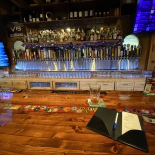 a bar with a menu on the counter