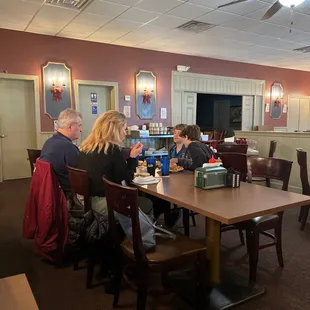 a group of people sitting at a table