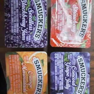 four packets of snacks on a table
