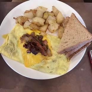 Western Omelette with extra Bacon; Hashbrowns and Wheat Toast.