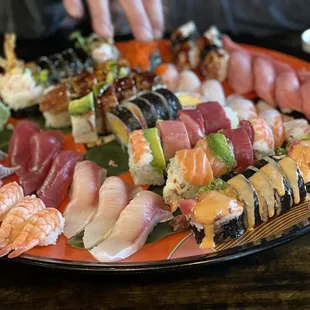 a large platter of sushi