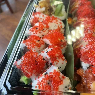 sushi rolls in a plastic container