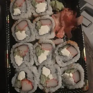 a plate of sushi rolls