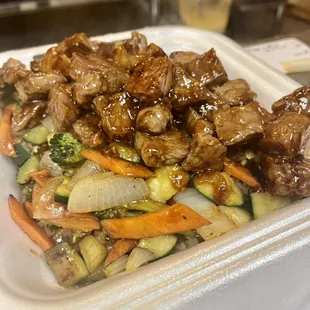 a close up of a takeout container of food