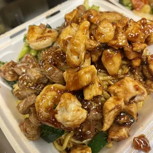 two takeout containers of food