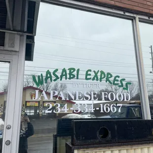 Exterior of building and phone number