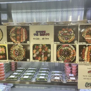 a display of sushi and rolls