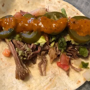 Carnitas spiced up with jalapeño and tomatillo salsa!