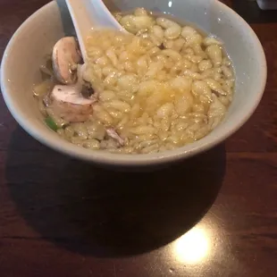 a bowl of soup with a spoon in it