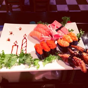 Salmon and krab stick and eel and flying fish egg and spicy flying fish egg