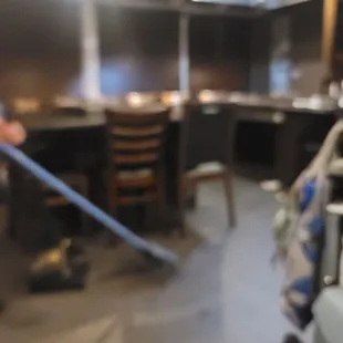 a man cleaning a kitchen