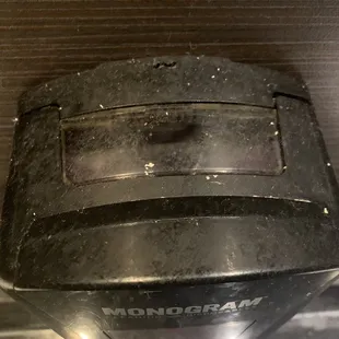 Top of soap dispenser in women's restroom