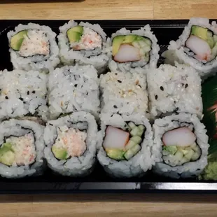 a plate of sushi rolls on a table