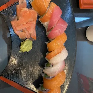 Our favorite rolls rainbow roll with spicy tuna inside.