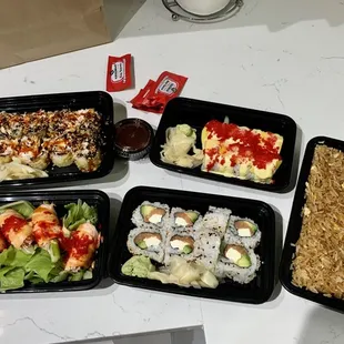 Yummy roll, mango roll, fried rice, baked salmon, philly, fried rice