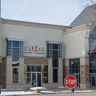 a stop sign in front of a building