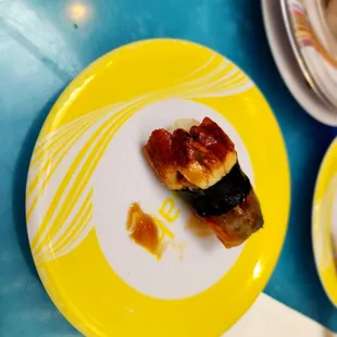 Eel nigiri.I ate one haha. Sorry for the weird layout.