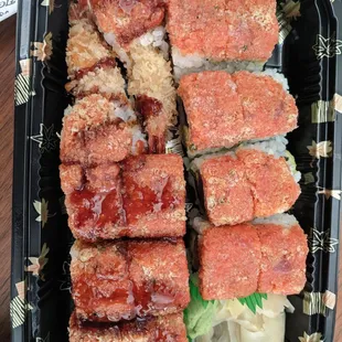 Godzilla Roll - spicy tuna rolled with jumbo shrimp tempura and eel sauce