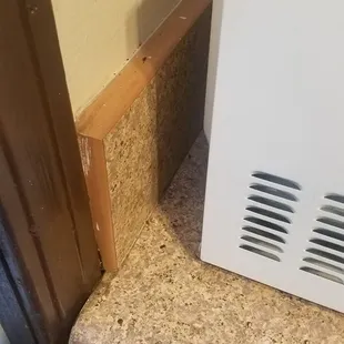 Behind microwave - chipmunk had to hop up on this cabinet to poop behind there. Isn't connected to other cabinets