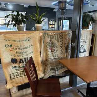 a table and chairs in a coffee shop