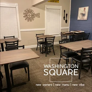 tables and chairs with a clock on the wall