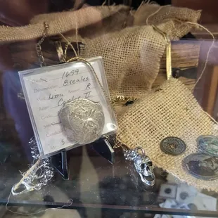 An exhibit with a coin from 1699.