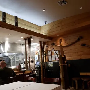 a man sitting at a table in a restaurant