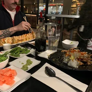 a man eating sushi