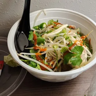 a salad in a plastic bowl