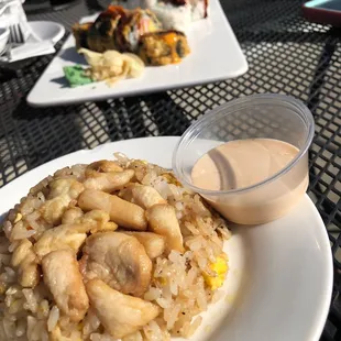 Fried rice, sushi, rangoons in the back