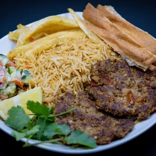 a plate of food with french fries and a salad