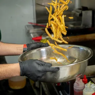 a person in a kitchen preparing food