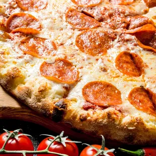 a pepperoni pizza on a cutting board