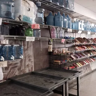 shelves of bottled water in a grocery store