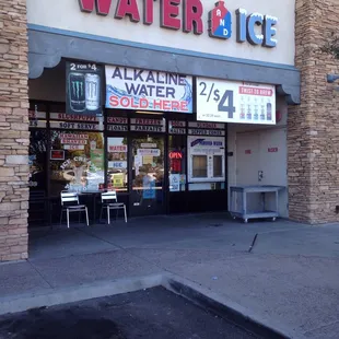 a storefront with a sign for water and ice
