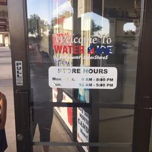 a woman standing in front of a store