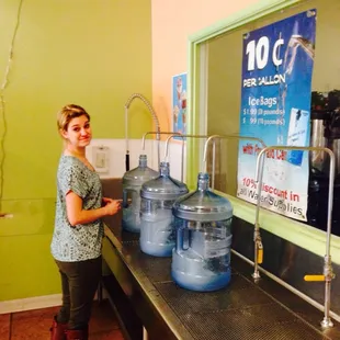 a woman standing in front of a counter