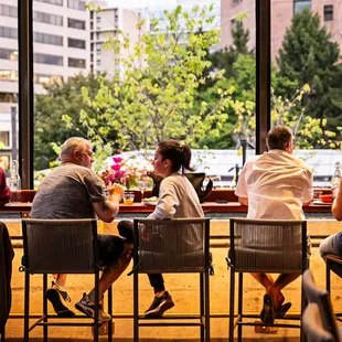 a group of people sitting at a table