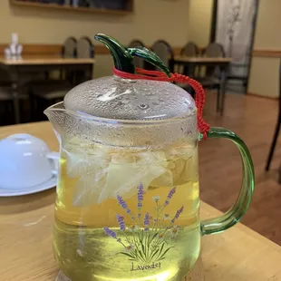a glass teapot filled with tea