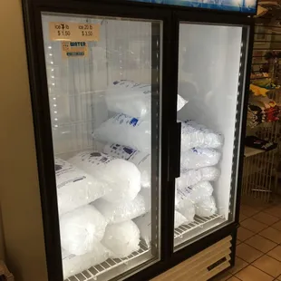 a freezer filled with bags of water