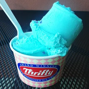 a cup of ice cream with a spoon