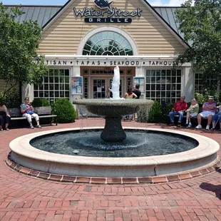 a fountain in front of a building