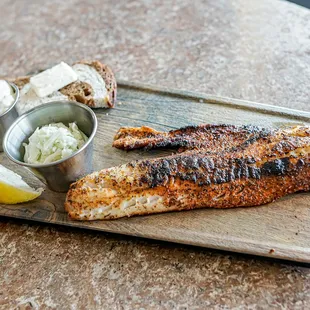 grilled fish on a cutting board