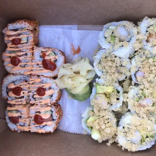 Spicy salmon roll one left (took picture after one piece) and Shrimp tempura roll on right