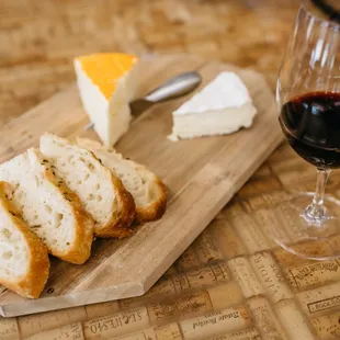bread, cheese, and a glass of wine