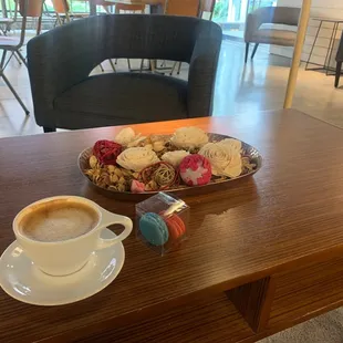 a plate of cookies and a cup of coffee