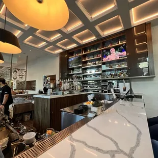 a restaurant with a marble counter top